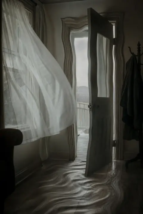 A front door stands ajar as a cold draft lifts the curtains and the frame warps, a dream of a home invasion
